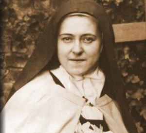 sepia=toned image of a Catholic sister wearing a habit and looking at the camera