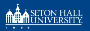 A blue-and-white Seton Hall University logo featuring three white steepled buildings with crosses, the founding year “1856” below, and the words “Seton Hall University” in bold white capital letters to the right.